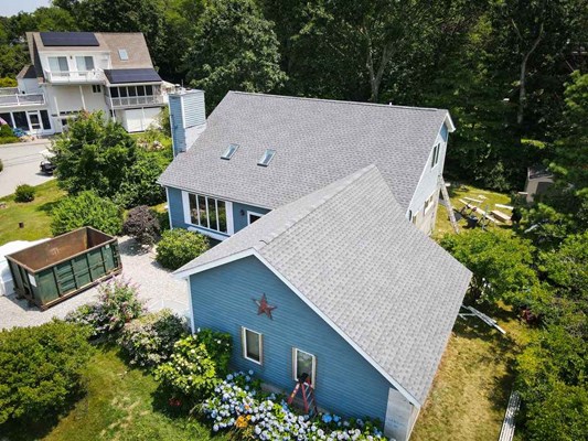 Experienced roofers installing a modern roof in Rhode Island